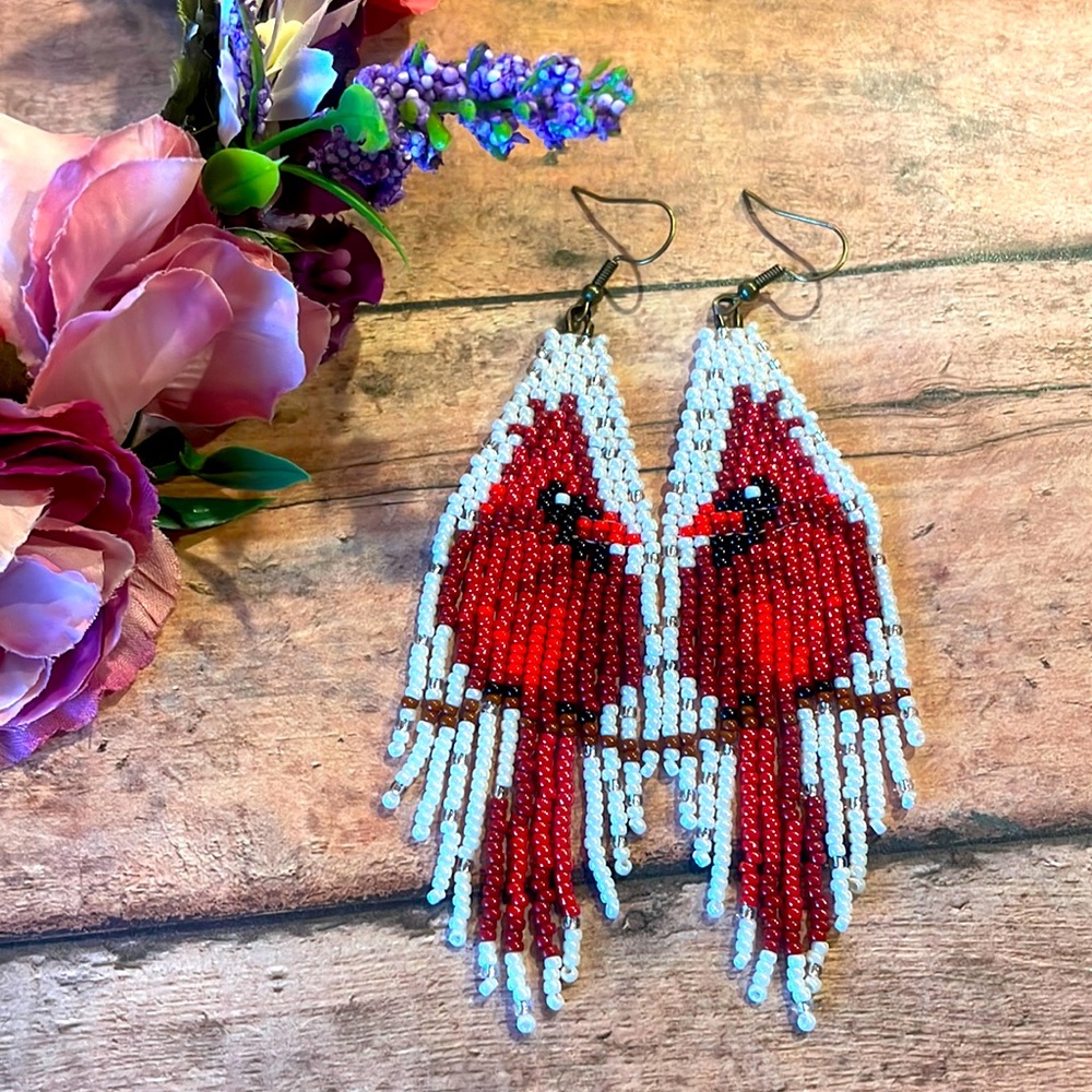 Red Cardinal birds in white